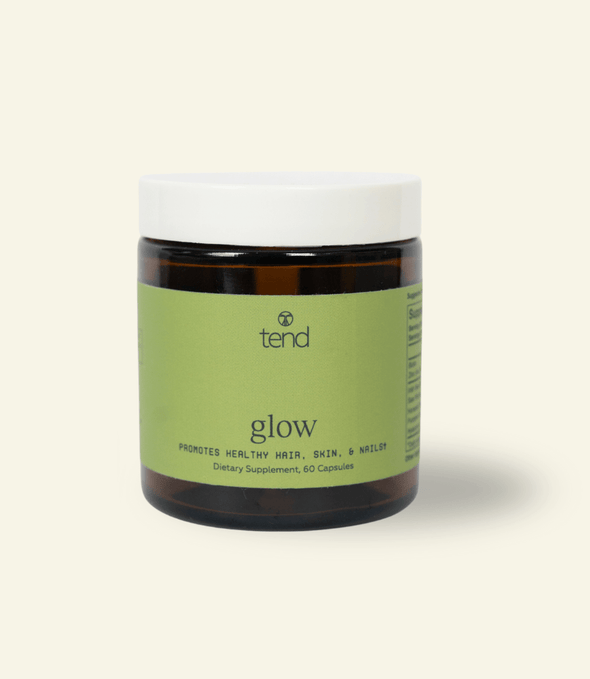 Tend Glow supplement bottle for healthy skin, hair, and nails with botanical and mineral blend
